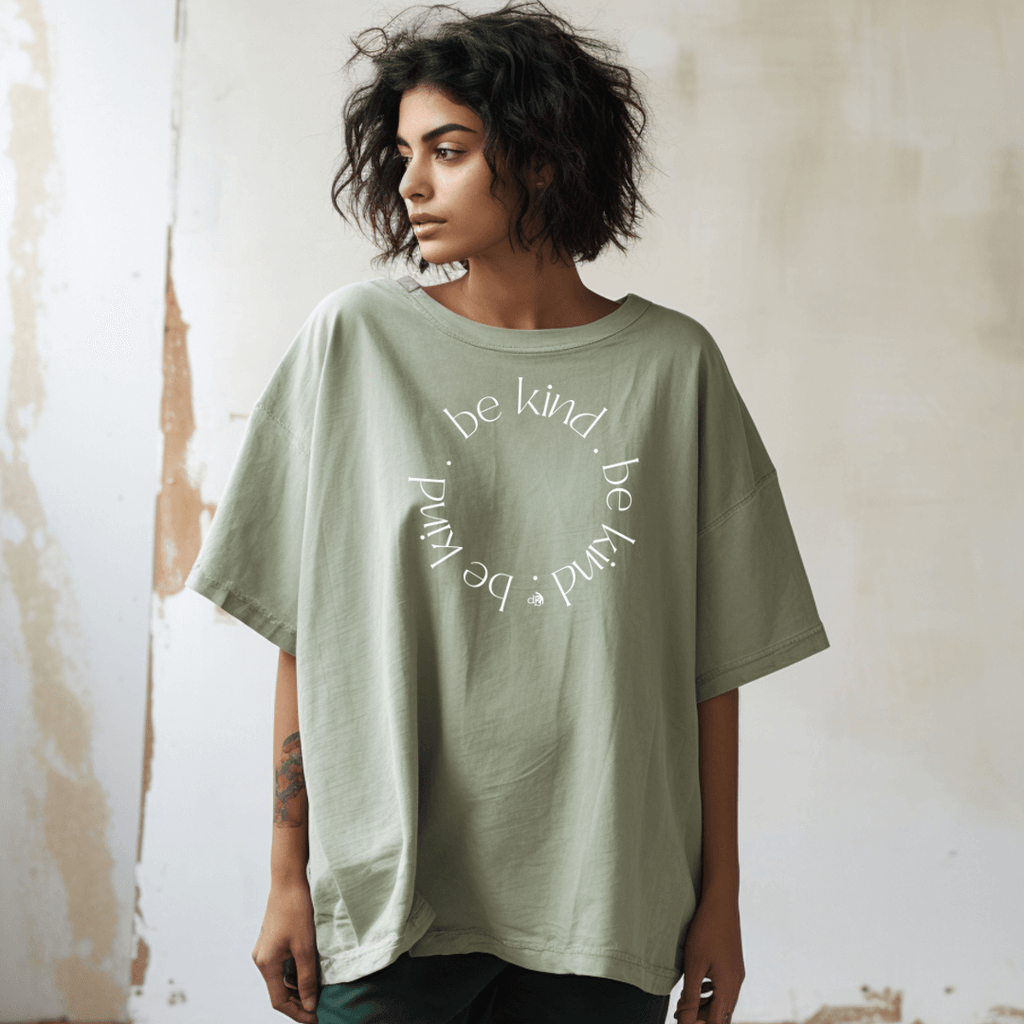 Bay green Be kind Inspirational t-shirt on a model standing up - print pattern is Be Kind in a circle with white color screen