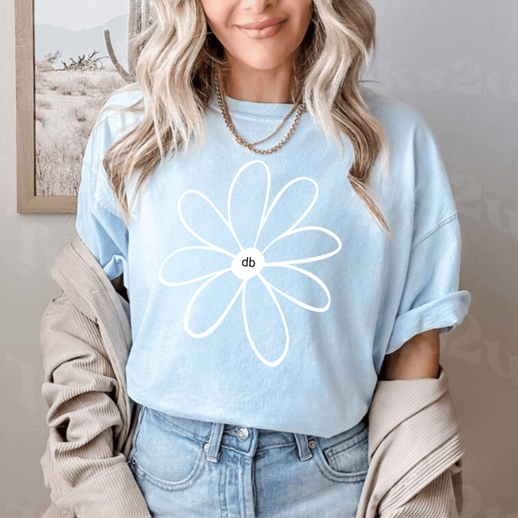 Positive Vibe Daisy Screen T-shirt with model standing wear jeans - tee color is chambray blue with white daisy screen