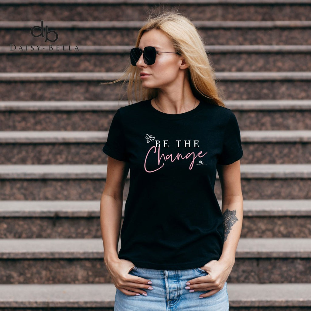 woman in short sleeve black inspirational shirt graphics saying we are who we are