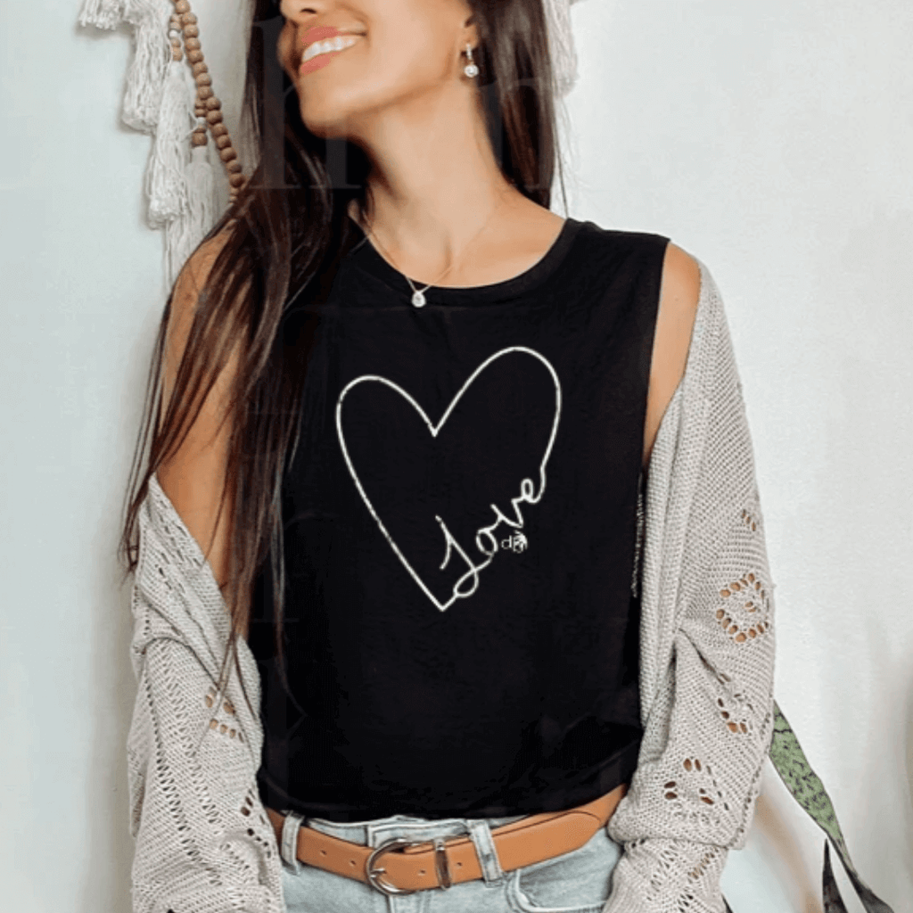 Model standing against the wall wearing a black color muscle Inspirational tank with a large white heart shape with the word love screen