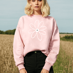  Blonde model standing in field wearing Daisy-Bella Pink Daisy Positivity Sweatshirt 