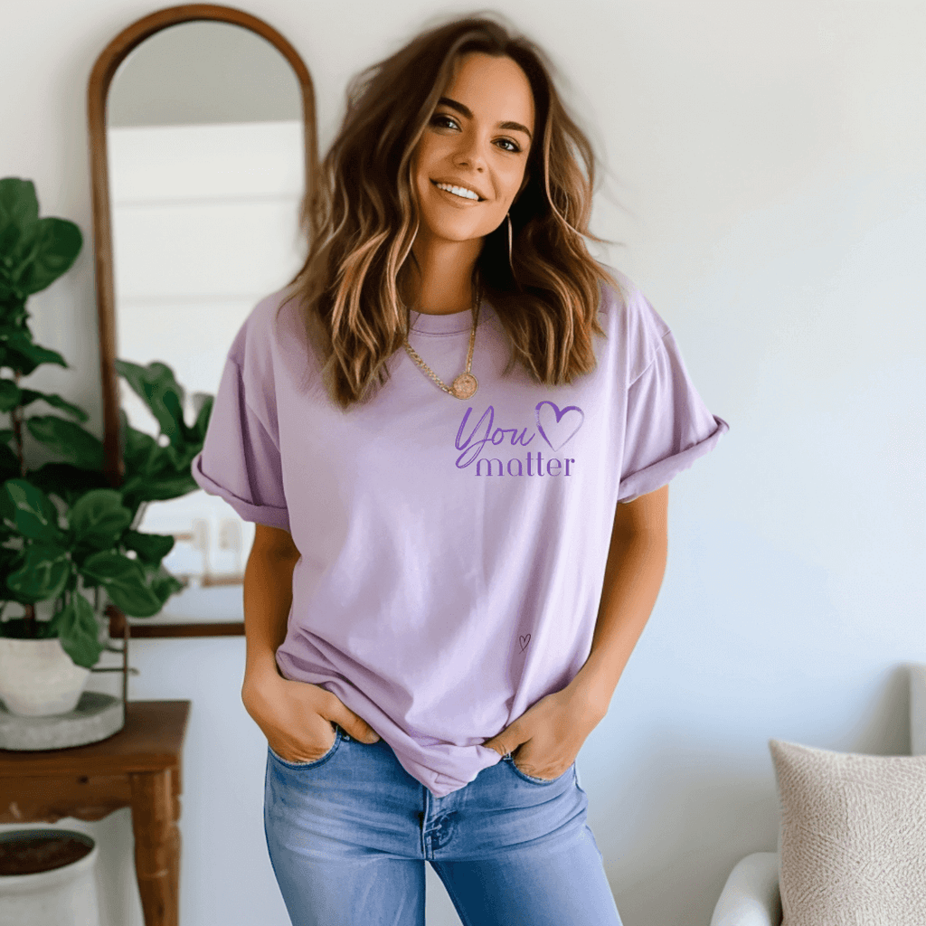 You Matter Inspirational T-shirt in violet color on model standing up in room with furniture