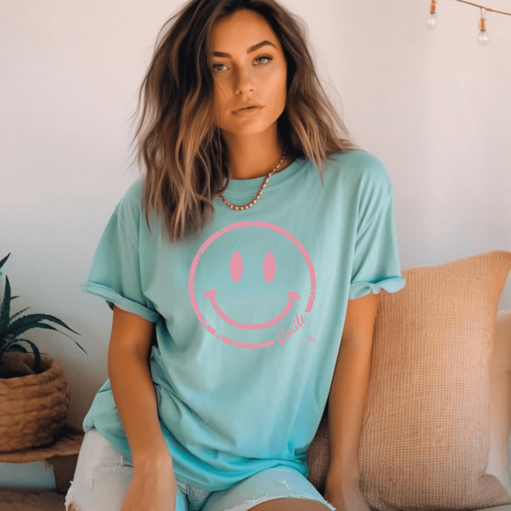Happy Pink Face short sleeve T-shirt on model sitting down - tee color chalking mint 