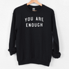 Inspirational saying sweatshirt You are enough black color on a hanger